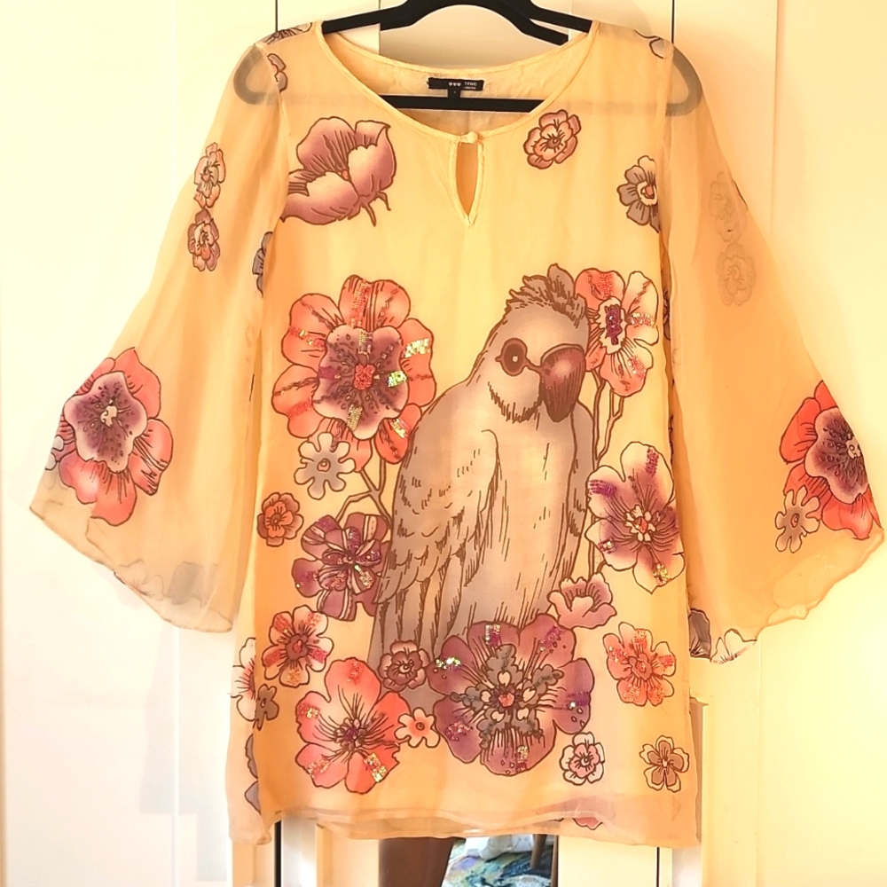 Beautifully adorned sequin dress with bird and floral design bell sleeves